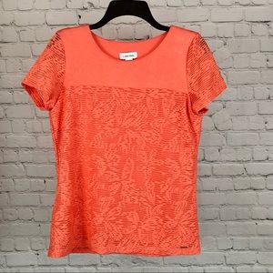 Women’s Calvin Klein textured floral blouse in the color porcelain rose. Size M